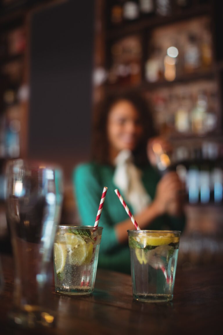 Two glasses of cocktail on worktop at bar counter